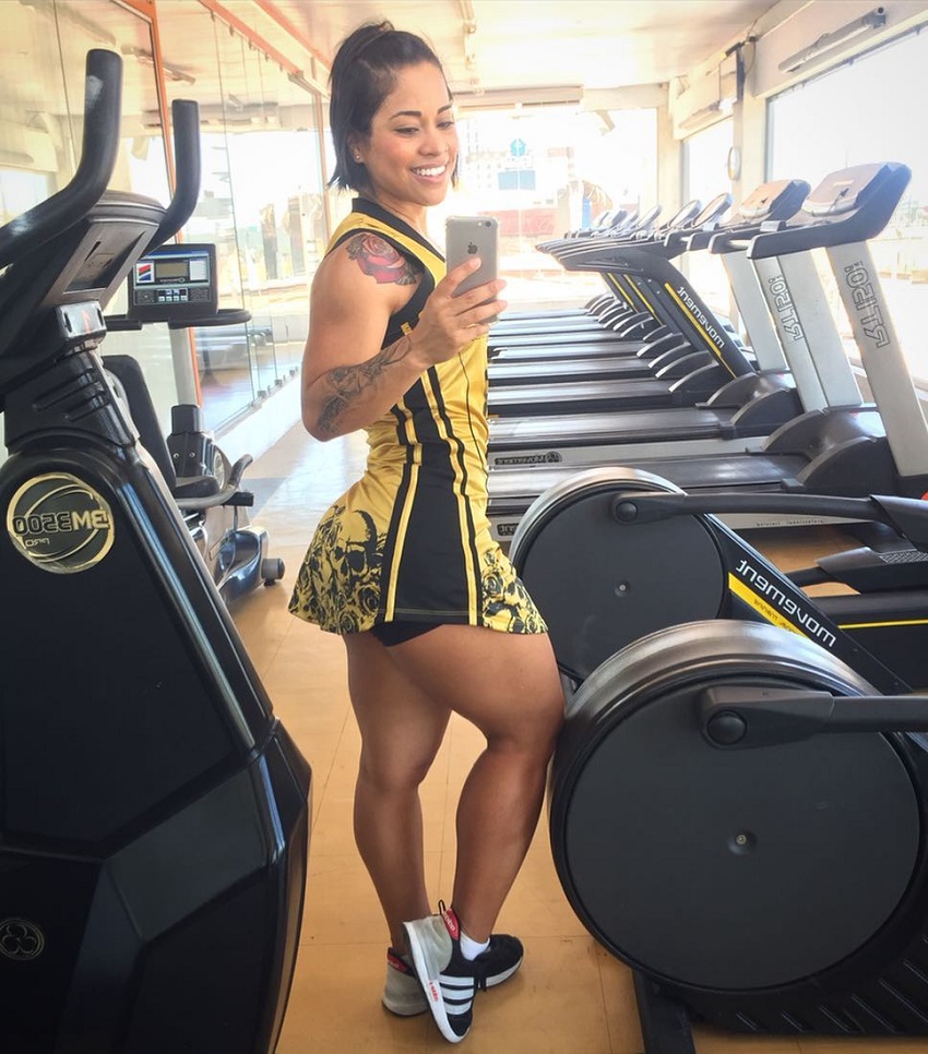 Rosana Ollyver taking a picture of herself near cardio machines